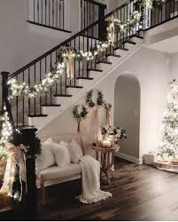 Holiday Decorations That Aren T Too Much Or Too Little Just The Right Amount Of Holiday Cheer Makes This Christmas Entryway Christmas Home Christmas Staircase