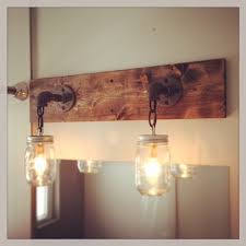 This three light aged bronze bathroom vanity light from the hainsbrook collection adds a rustic look to your room. Industrial Rustic Modern Wood Handmade Mason Jar Light Fixture Mason Jar Light Fixture Mason Jar Lighting Jar Lights