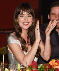 Dakota johnson has a tattoo on her left bicep reading acta non verba which is latin for deeds not words Dakota Johnson Tattoo Guide To Every Meaning Location