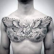 Memorial Guys Wing Heart Upper Chest Tattoo Ideas Cool Chest Tattoos Chest Tattoo Ideas Wings Chest Tattoo