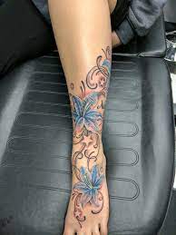 Lily Tattoo Lilies Foot Ankle Tattoo Stars Leg Calf Tattoos Ankle Foot Tattoo Ankle Tattoo Designs Foot Tattoos For Women