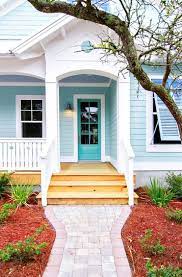 Beatiful house color in florida. Make Your Front Door Shine With Beautiful Shades Of Seaside Blue Cottage Exterior Colors Beach House Colors House Paint Exterior