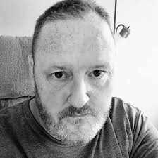 Motorcyclists perform wheelies