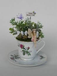 These fairy garden artificial plants not only make your decor seem aesthetically appealing but also give you a feeling of greenery all around you. Fairy Garden Tea Cup Miniature Garden Artificial Flowers Fairy Garden Designs Fairy Garden Diy Tea Diy