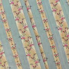 The pattern features a floral design that can be seen behind the woven fabric. Dust Teal Beige Multi Floral Stripe Print Dobby Decor Fabric Dfw55841 Discount Fabrics