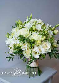 White roses flowers wedding bouquet. White Bridal Bouquet Composed Of White Roses White Freesia And Cream Lisianthus Nature Inspired Bouquet Flower Bouquet Wedding White Bouquet Bridal Bouquet