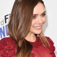 Fluffy hair in a comb on a red background. 29 Chestnut Hair Colors To Inspire Your Next Salon Visit