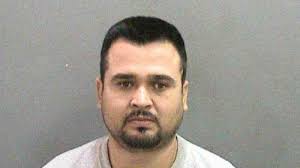 Man charged with killing mom's houseguest