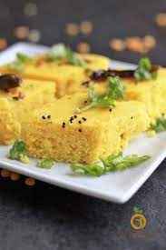Crunchy capsicum strips are placed on the idli base before rolling and cutting it up like a sushi! Instant Khaman Dhokla Authentic Gujarati Recipe Bellyrulesthemind