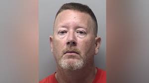 Ex-cop accused of taking advantage of fallen officers' families