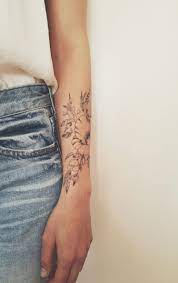 You will love to check hundreds of stunning rose & lotus floral tattoo hence, flower tattoos are one of the most fascinating tattoo design options available for tattoo lovers. Floral Tattoo By Indigo Evolution Wrap Around Tattoo Floral Tattoo Wrap Around Wrist Tattoos