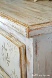 White And Gold Distressed Damask Dresser A white dresser is an elegant, classic look!