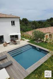 une piscinelle en parfaite harmonie avec son environnement piscine carre photo piscine piscine amenagement paysager