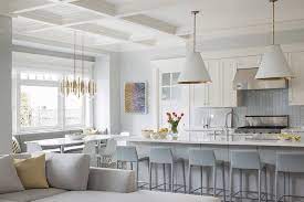 A cozy table in the kitchen can create space for moments throughout the day: Design Dilemma Coordinating Kitchen Island And Breakfast Nook Lights