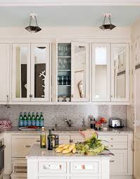 Free plans to diy a kitchen cabinet door organizer for paper towels and cleaning supplies! Mirrored Cabinet Doors Ideas To Update The Kitchen House Beautiful Traditional Kitchen Other Houzz