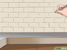 Mark the center of the wall. How To Install Subway Tile Backsplash With Pictures Wikihow