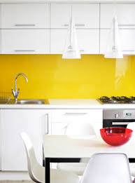 Contemporary White Kitchen With Yellow Glass Splashback Yellow Kitchen Decor Kitchen Interior Kitchen Tiles