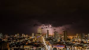 thunderstorms above city during night