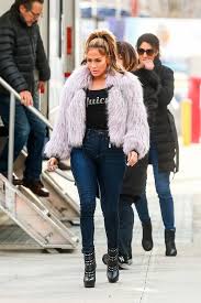 Why,she has her own coats that are more expensive? Jennifer Lopez Sports Juicy Top Pink Faux Fur Jacket And Skin Tight Jeans While Filming Her Upcoming Movie Hustlers In New York City 270319 7