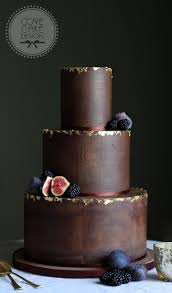 Dark Chocolate Ganache Wedding Cake With Edible Gold Leaf And Winter Berries Cake Is Wedding Cake Chocolate Ganache Chocolate Wedding Cake Guinness Chocolate