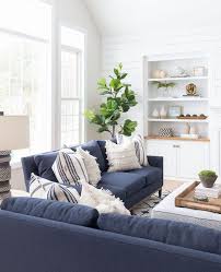 Light peach on your living room walls is an easy and effective way of making your space look warm and cheery without being overwhelming. A Pennsylvania Colonial Gets A Breezy Revamp Blue Living Room Decor Navy Sofa Living Room Blue Sofas Living Room
