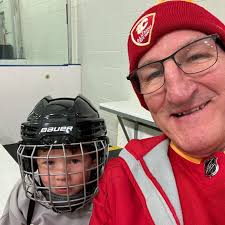It's Flames First Shift game day! Tim Hunter is at the rink, helping out  all of these young athletes and cheering them on!
