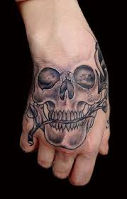 80 Frightening And Meaningful Skull Tattoos Nenuno Creative Hand Tattoos Skull Tattoo Hand Tattoos For Guys