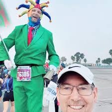 What former club member has completed 327 marathons?