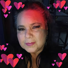 A woman was sent to the hospital Thursday morning after being struck by a  vehicle as she stood near her front driveway