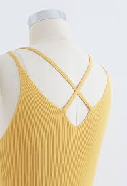This is a slightly cropped, sleeveless sweater with a higher neck. Fitted Ribbed Knit Cami Dress In Yellow Retro Indie And Unique Fashion