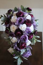 If you're a purple lover, you'll definitely want to pull inspiration from these gorgeous wedding ideas. Lavender Plum And Ivory Silk Wedding Flowers Silk Wedding Flowers And Bouquets Online Love Is Blooming