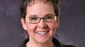 Ellen McWilliams-Woods will delay retirement from Akron schools a year