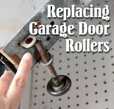 Loosen the brackets securing it to the ceiling and gently lower it down. How To Replace Garage Door Rollers Pretty Handy Girl