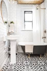 Rustic is the first thing that comes to mind in this master bathroom in lake martin, alabama by designer susan ferrier. Before After A Little Black White Bathroom Gets An Update Small Bathroom Black White Bathrooms Bathroom Makeover