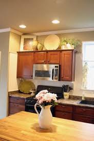 How To Decorate Above Kitchen Cabinets Decorating Above Kitchen Cabinets Kitchen Cabinets Decor Home Kitchens