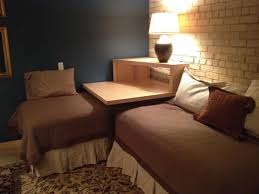 Twin loft bed with staircase. This Corner Table Converts Two Twin Beds Into A Sleeping Or Lounging Space Corner Twin Beds Corner Bed Table Twin Bed Couch