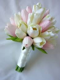 Above, tulips are paired with ranunculus and hydrangea for a monochromatic white tablescape. Tulip Bouquets Wedding Classic Tulip Bridal Bouquet Artificial Wedding Bouquet Wedding Flowers Tulips Tulip Wedding Tulip Bridal Bouquet