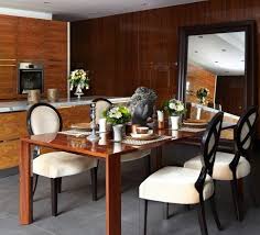 Reminiscent of old world styling, this round dining table features an etched base crafted from solid espresso wood. Dining Room Furniture Design