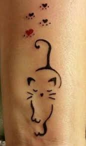 This tattoo has beautiful flowers with a little color that has been made at the. Cute Cat Tattoo Cat Simple Tattoos Simple Tattoos Momcanvas