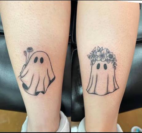 What Halloween-themed leg sleeve ideas go with ghost tattoos?