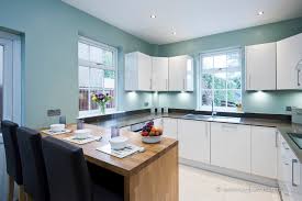 white kitchen dark worktops with blue