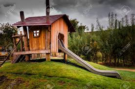 Unique design and fun colors set this house apart from other backyard playhouses. Childrens Wooden Playhouse With Slide Stock Photo Picture And Royalty Free Image Image 23286625