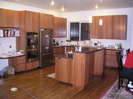 Ribbon Sapele Cabinets Things To Consider With Sapele Wood Cabinets Sapele Darkens Over Time It Goes To A Rich Brown Wi Sapele Home Kitchens Kitchen Storage
