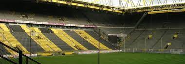 The yellow wall the 25 000 capacity southern terrace of borussia dortmund s home stadium is also a face that charts the club s emotional wellbeing. Signal Iduna Park Dortmund The Stadium Guide