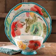 The plates and bowls have a speckled ceramic surface with a more raw, colored clay bottom. The Pioneer Woman Vintage Bloom 12 Piece Dinnerware Set Turquoise Walmart Com Walmart Com