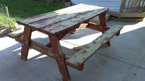 If the finish on your wooden picnic table is nearing its end, rejuvenate the table by sanding it and applying fresh stain and wood sealer. Rehab An Old Picnic Table Youtube
