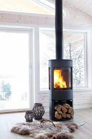 A scandinavian wood stove heats a modern space with an open floorplan. 3 Cool Types Of Fireplaces And 25 Examples Digsdigs