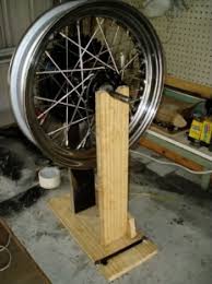 We recommend using a truing stand. Homemade Wheel Truing Stand Homemadetools Net