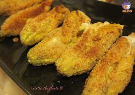 Lavate i fiori di zucca, puliteli e riempiteli con delicatezza con il composto precedentemente preparato; Fiori Di Zucca Ripieni Cotti Al Forno