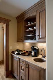 Be sure that the dimensions are about 1/2 inch smaller in diameter than the sink's edges. Coffee Bar Cabinetry With Recessed Hammered Sink And Travertine Countetop Traditional Home Bar Milwaukee By Cabinetwerks By Orren Pickell